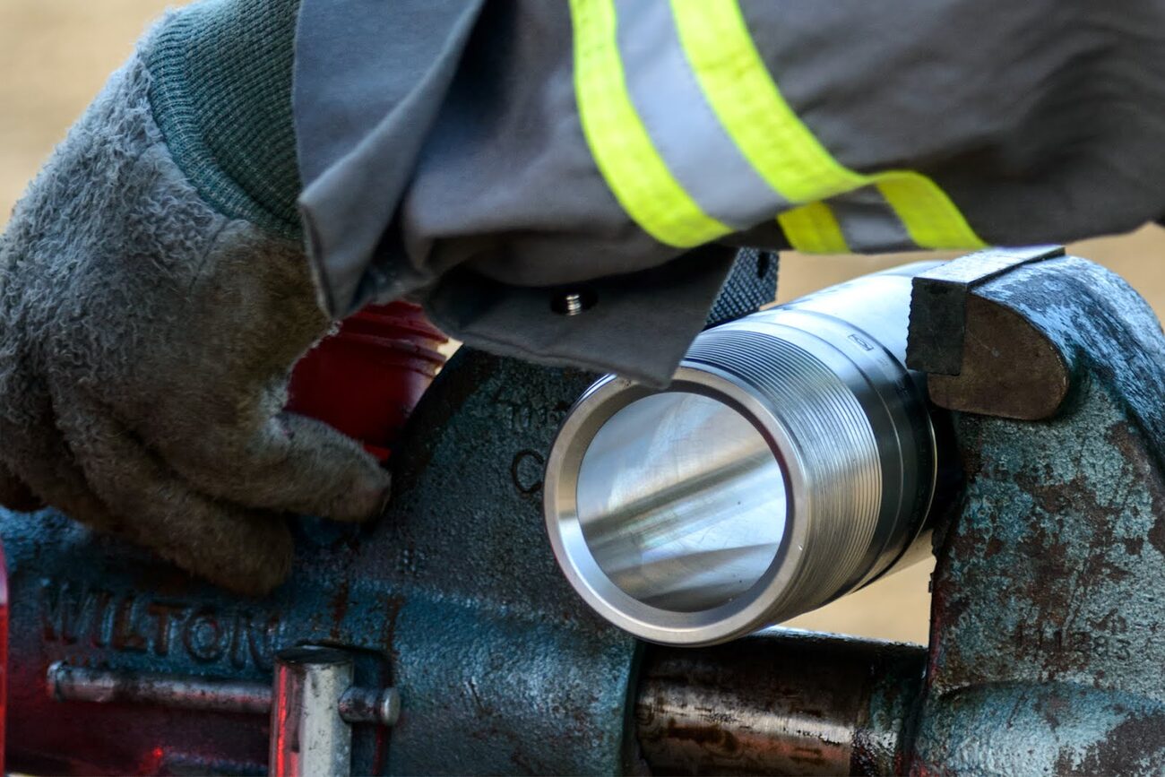 Close-up of a wireline tool being serviced